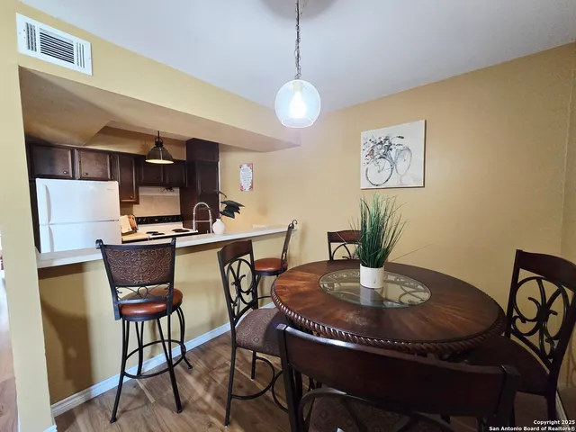 a view of a dining room with furniture