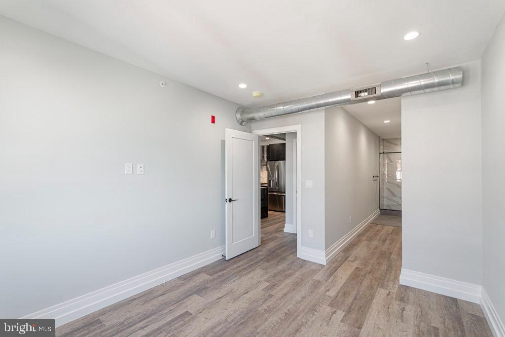 526 Brown Street, Unit 403 Philadelphia, PA 19123 - Photo 8 of 13 a view of hallway with wooden floor