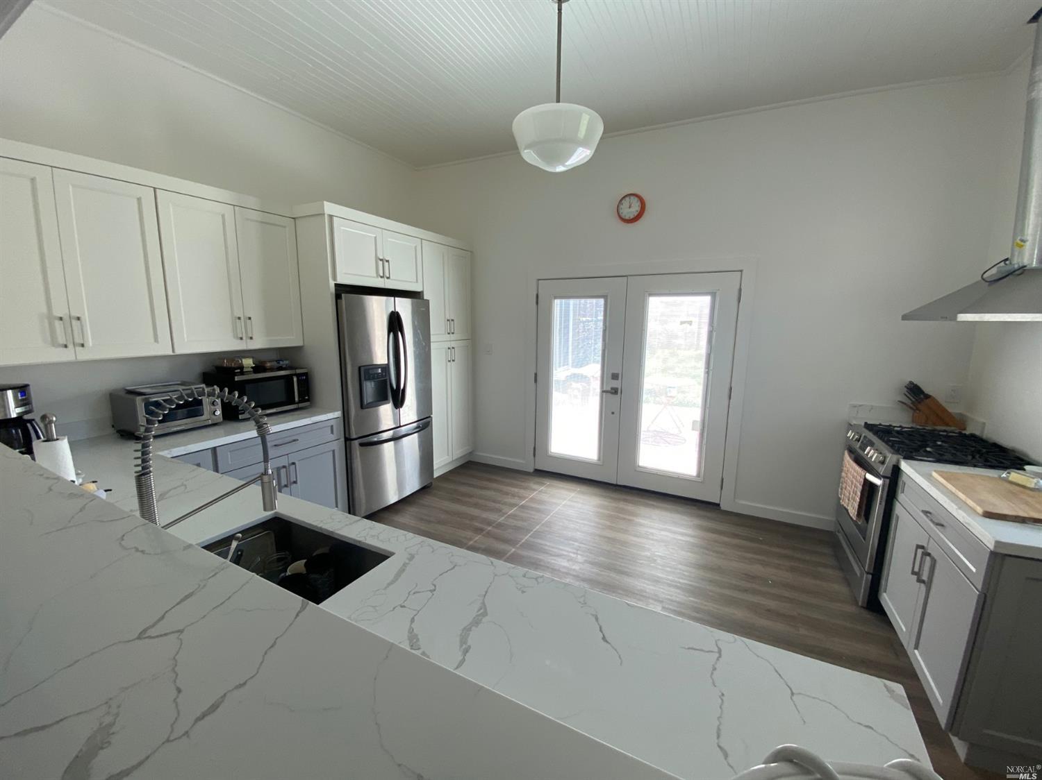 5380 St Helena Road Santa Rosa, CA 95404 - Photo 1 of 1 a kitchen with stainless steel appliances granite countertop a stove a sink and a refrigerator