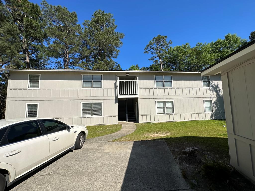 6908 Bullet Boulevard, Unit 7 Columbus, GA 31907 - Photo 8 of 9 a house view with a garden space