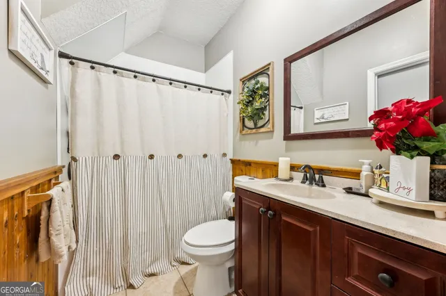 a view of a yard with a house in the background