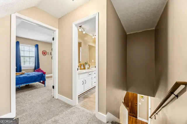 a view of a house with porch and garden