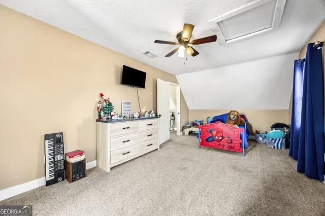 a view of a house with backyard sitting area and garden