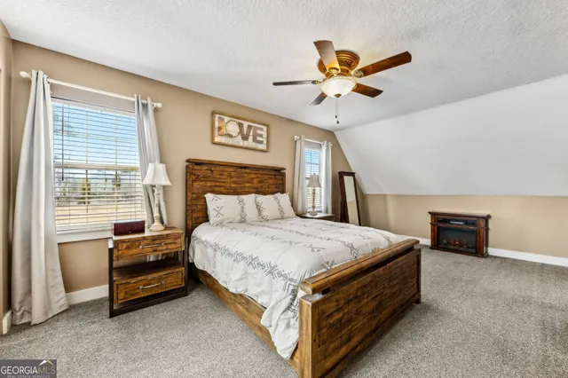 an aerial view of a forest with a yard