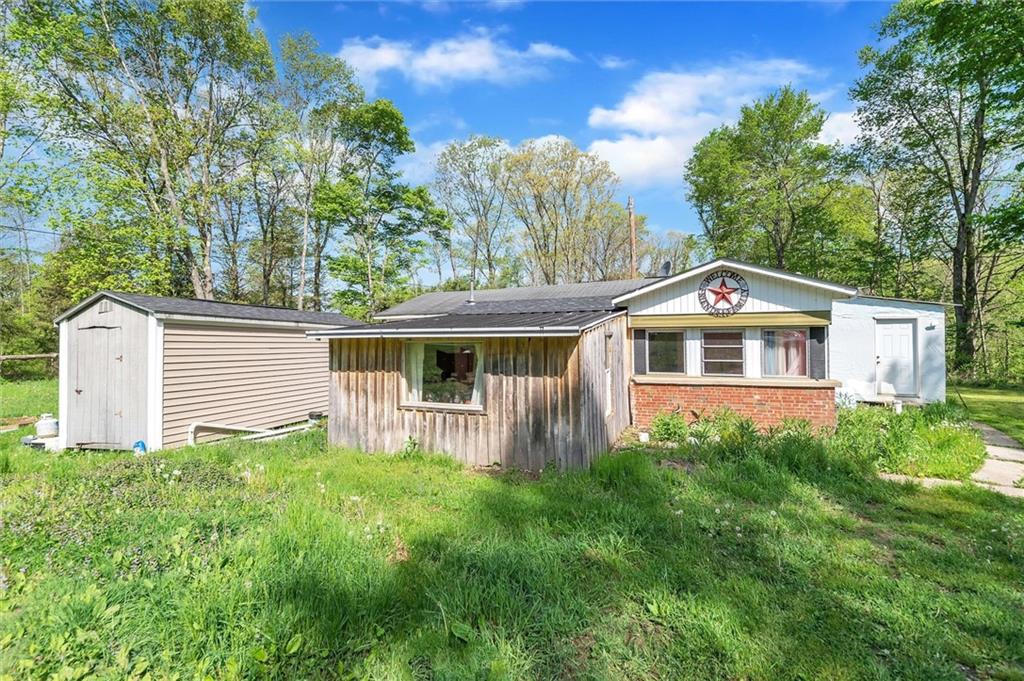 1799 Trusal Road Creekside, PA 15732 - Photo 11 of 24 a front view of a house with garden