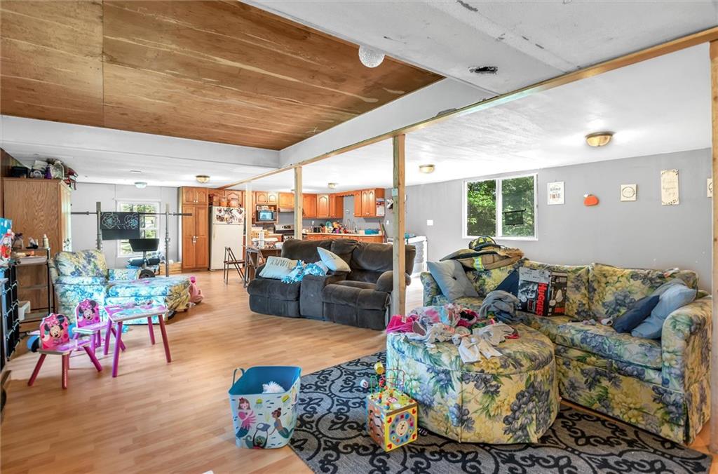 1799 Trusal Road Creekside, PA 15732 - Photo 13 of 24 a living room filled with furniture and a floor to ceiling window