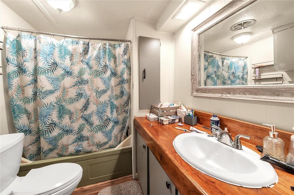 1799 Trusal Road Creekside, PA 15732 - Photo 15 of 24 a bathroom with a sink toilet mirror and tub