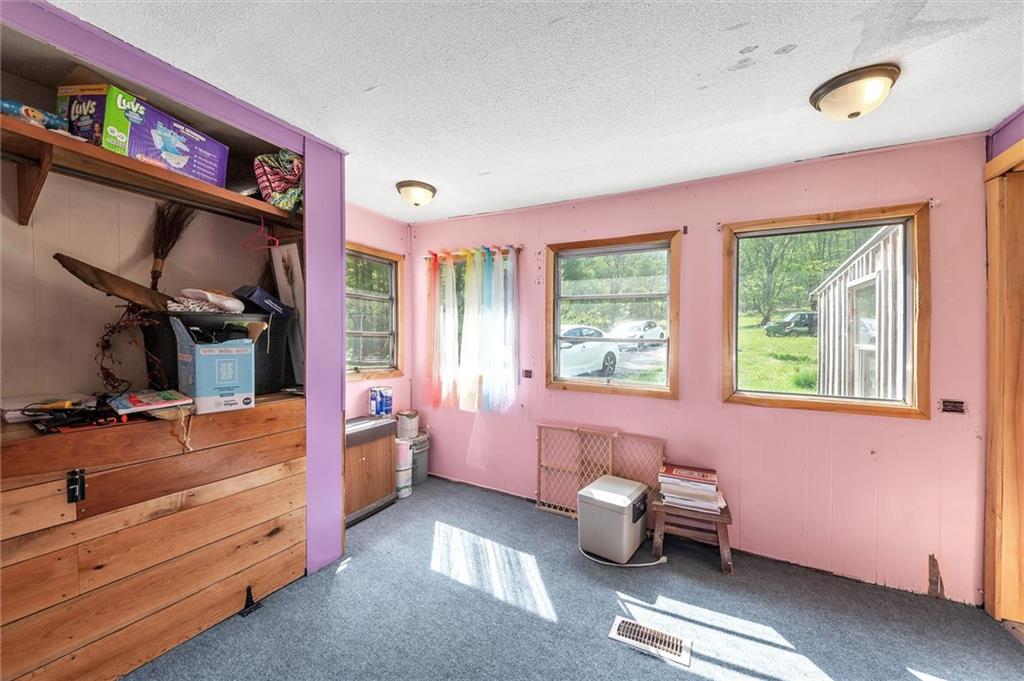 1799 Trusal Road Creekside, PA 15732 - Photo 17 of 24 a room with furniture toys and a window