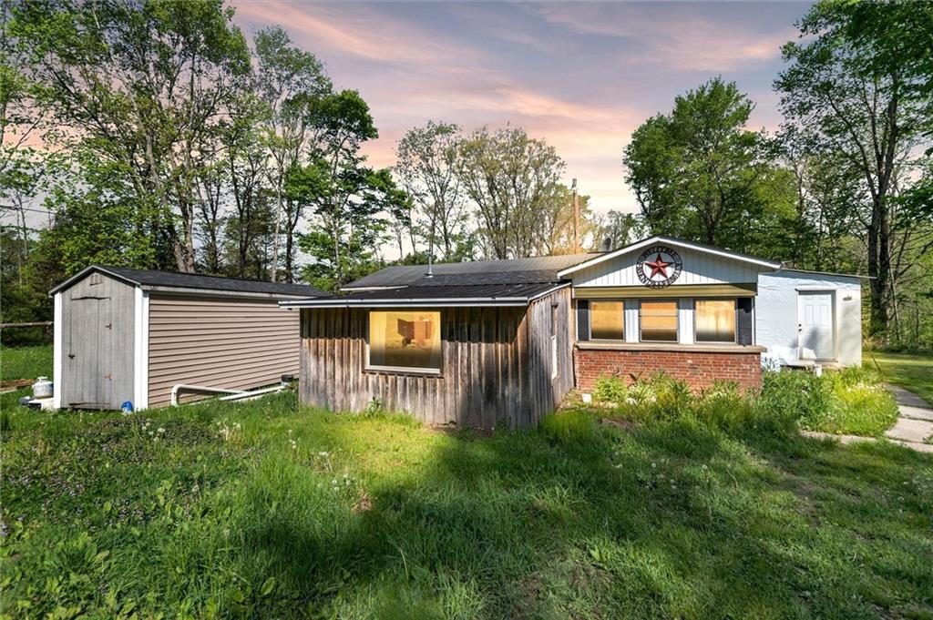 1799 Trusal Road Creekside, PA 15732 - Photo 2 of 24 a front view of a house with garden