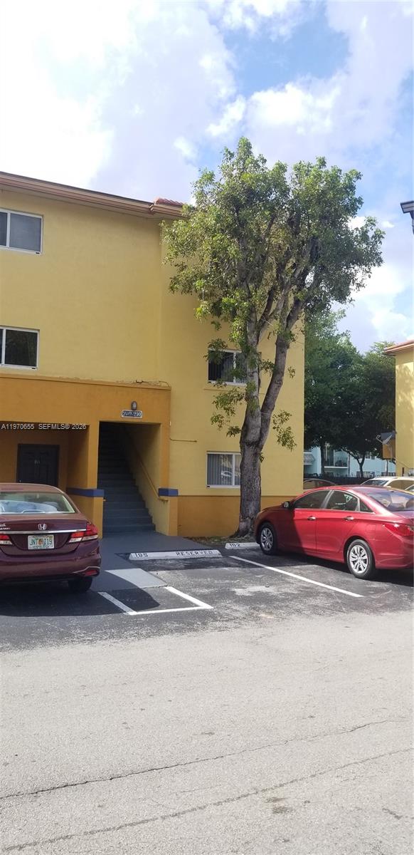 8250 Southwest 149th Court, Unit 8210 Miami, FL 33193 - Photo 1 of 23 a view of street with cars