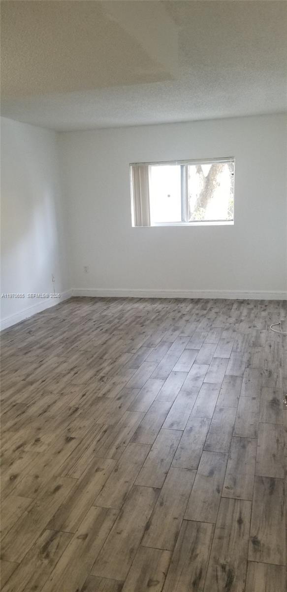 8250 Southwest 149th Court, Unit 8210 Miami, FL 33193 - Photo 6 of 23 a view of an empty room and window
