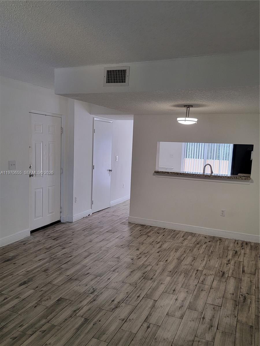 8250 Southwest 149th Court, Unit 8210 Miami, FL 33193 - Photo 8 of 23 a view of an empty room and window