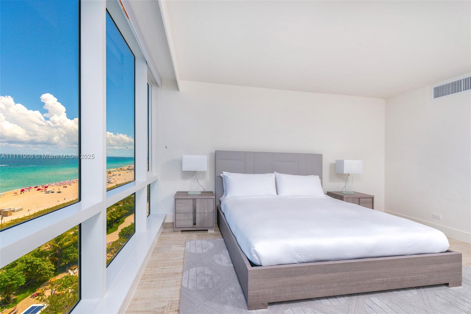 102 24th Street, Unit 1019 Miami Beach, FL 33139 - Photo 15 of 27 a bedroom with a bed and a painting on the wall