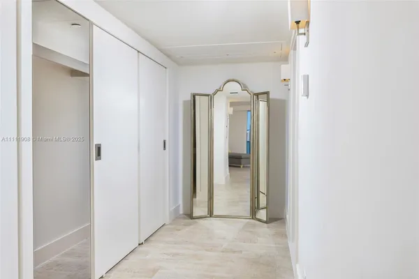 a view of a bathroom with mirror