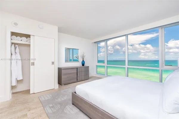 a bed room with a bed and a view of bedroom