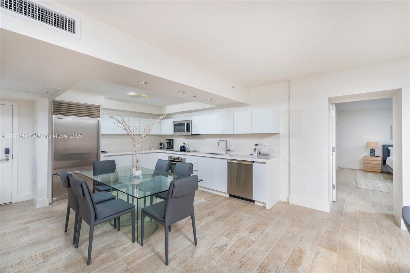 102 24th Street, Unit 1019 Miami Beach, FL 33139 - Photo 5 of 27 a view of a dining room kitchen and a window
