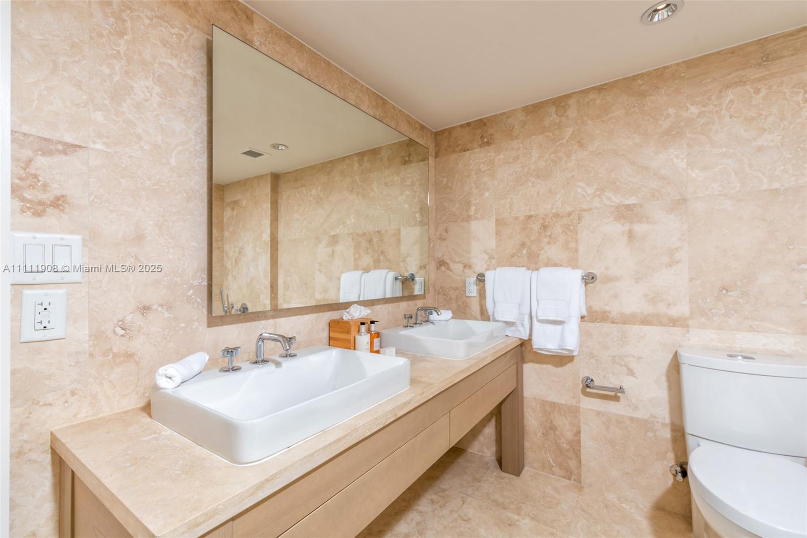 102 24th Street, Unit 1019 Miami Beach, FL 33139 - Photo 10 of 27 a bathroom with a sink and a toilet