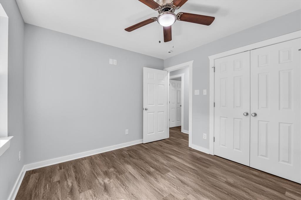 3608 North 26th Street Waco, TX 76708 - Photo 21 of 28 an empty room with a ceiling fan and wooden floor
