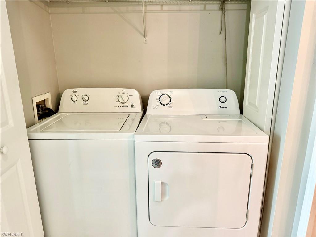 1200 Reserve Way, Unit 103 Naples, FL 34105 - Photo 11 of 26 a utility room with dryer and washer