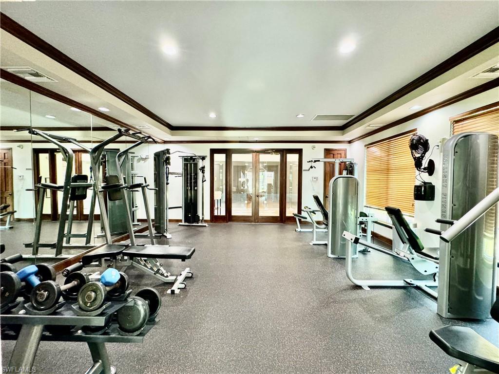 1200 Reserve Way, Unit 103 Naples, FL 34105 - Photo 21 of 26 a view of a room with gym equipment