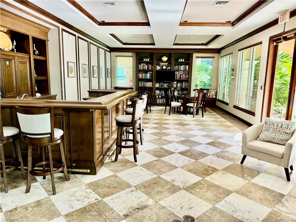 1200 Reserve Way, Unit 103 Naples, FL 34105 - Photo 22 of 26 a view of a livingroom with furniture and windows