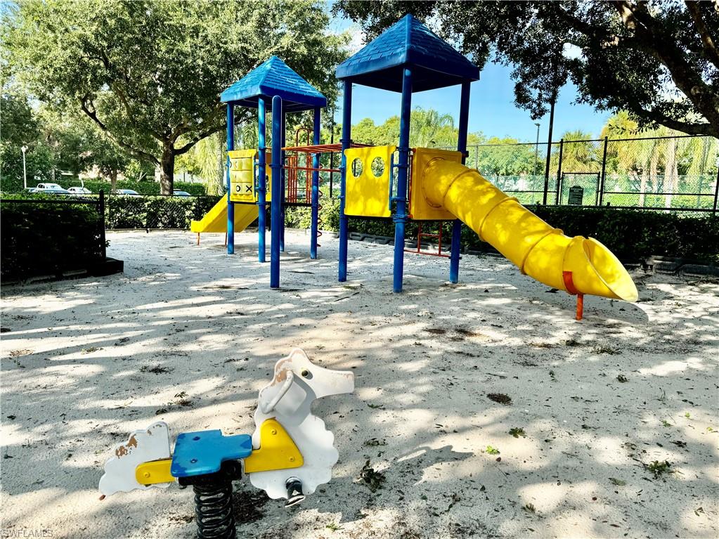 1200 Reserve Way, Unit 103 Naples, FL 34105 - Photo 24 of 26 a view of a park with slide
