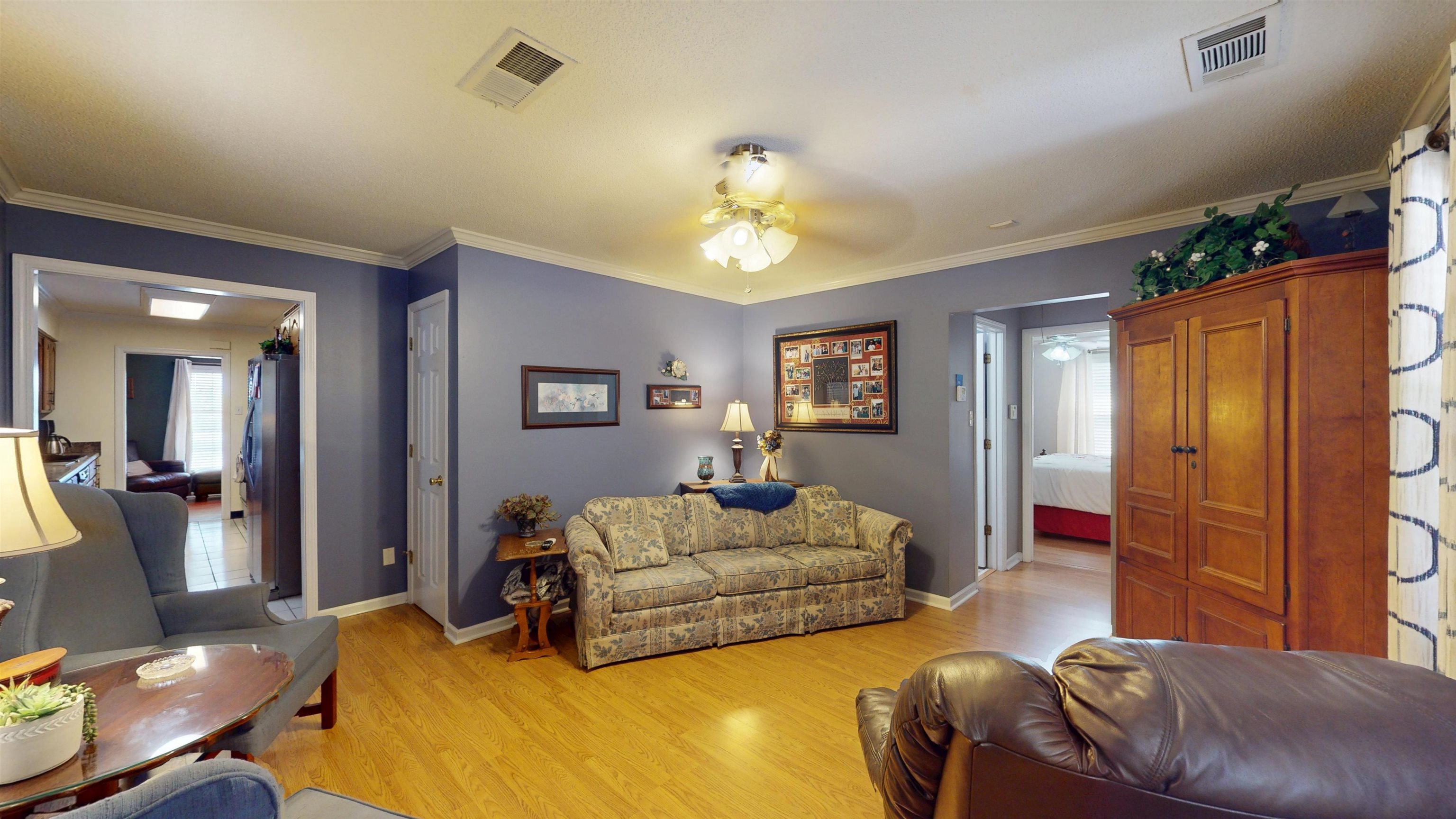 897 Bartlett Road Memphis, TN 38122 - Photo 12 of 33 a living room with furniture and a chandelier