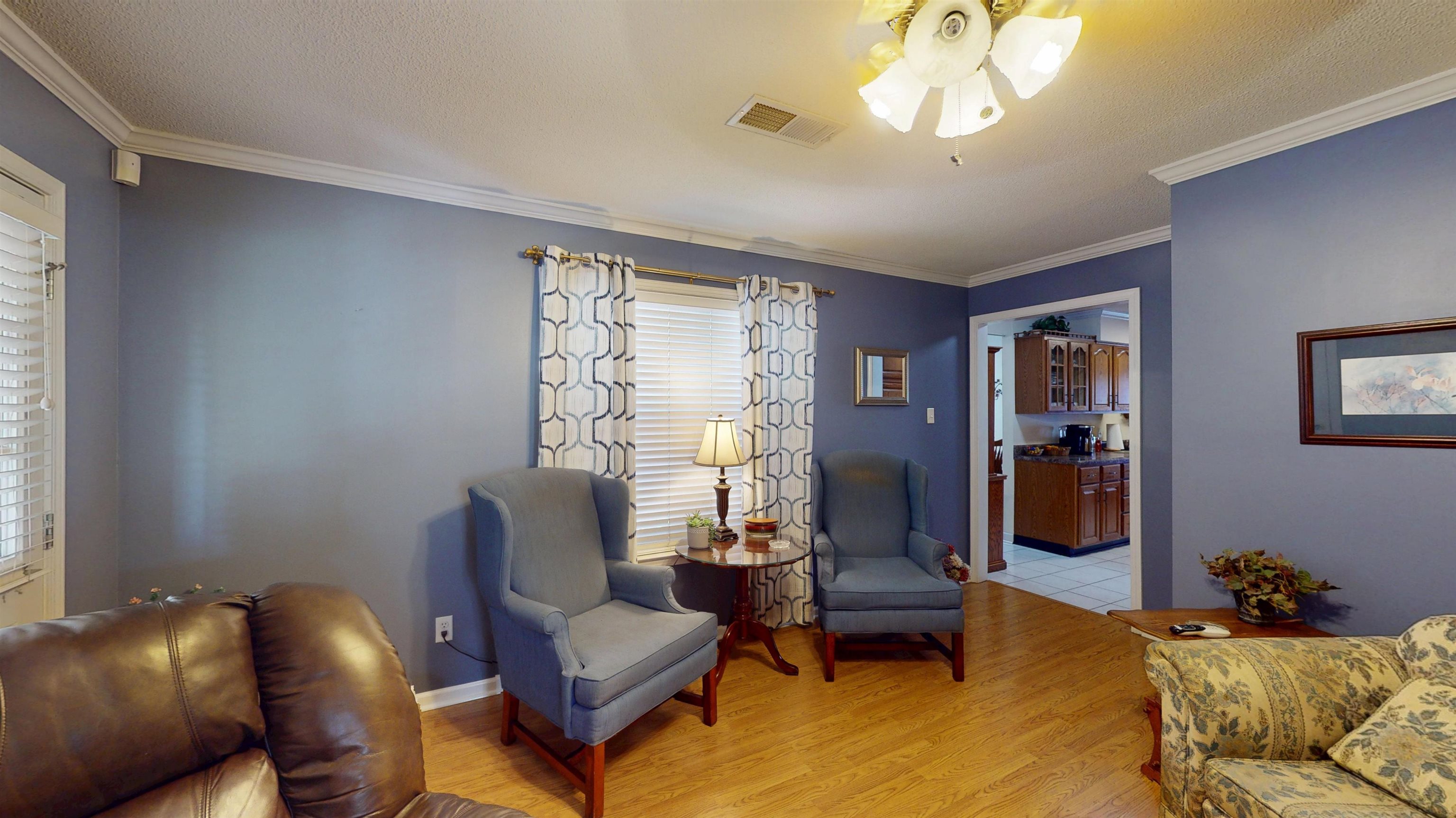 897 Bartlett Road Memphis, TN 38122 - Photo 14 of 33 a living room with furniture and a chandelier