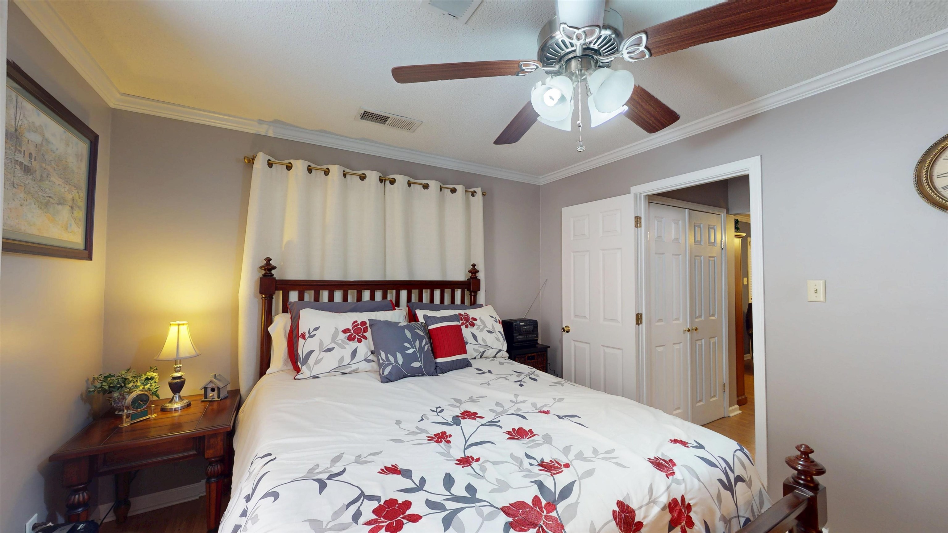 897 Bartlett Road Memphis, TN 38122 - Photo 17 of 33 a bedroom with a bed and a chandelier