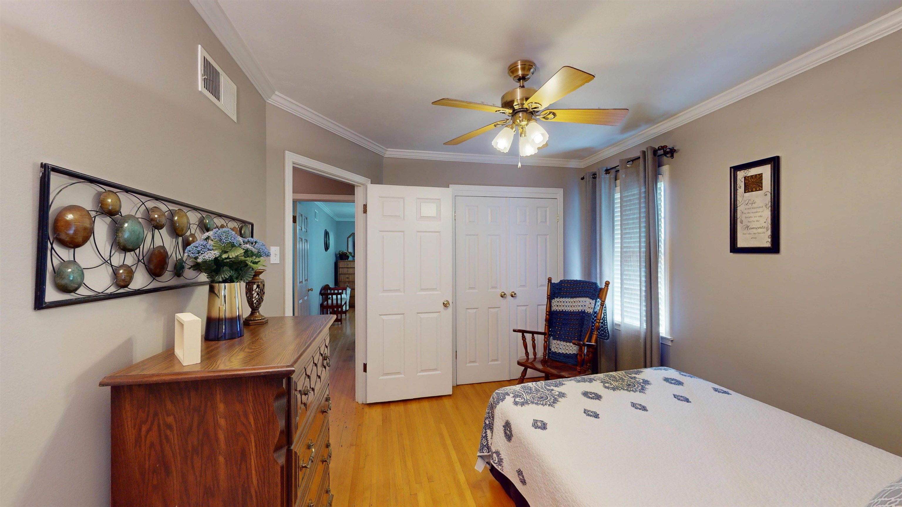 897 Bartlett Road Memphis, TN 38122 - Photo 18 of 33 a bedroom with a bed and a chandelier