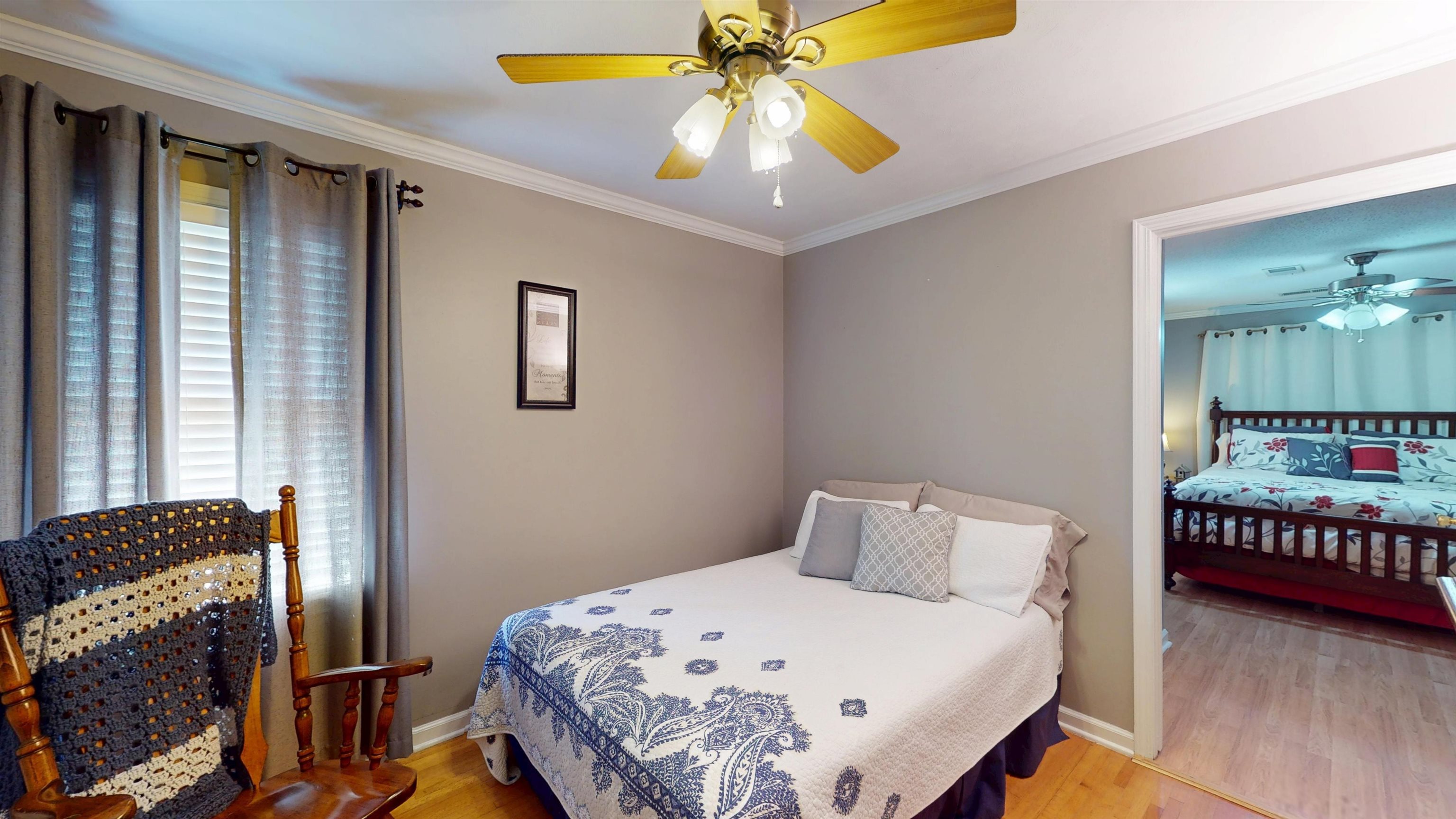 897 Bartlett Road Memphis, TN 38122 - Photo 19 of 33 a bedroom with a bed and a chandelier