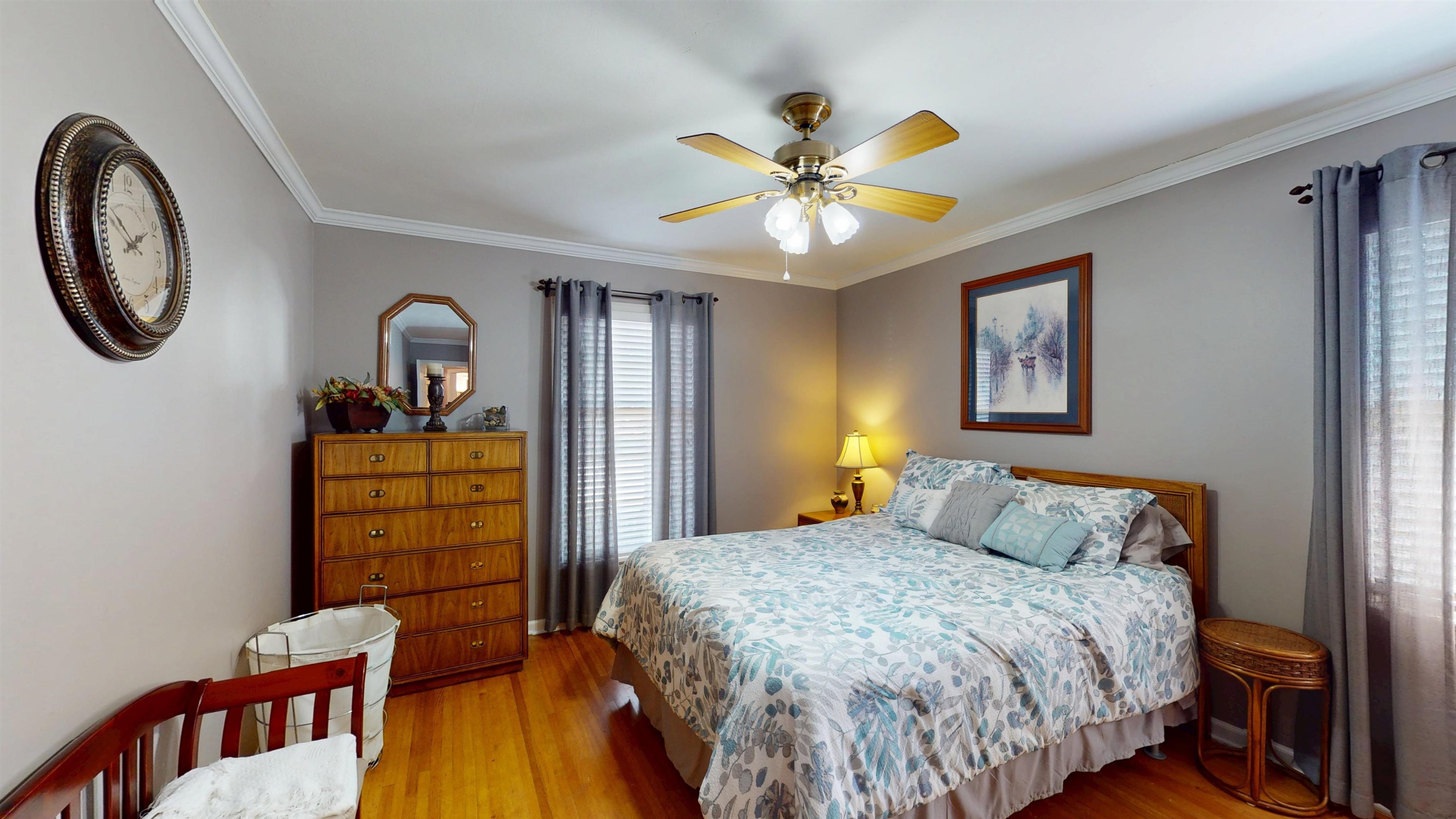 897 Bartlett Road Memphis, TN 38122 - Photo 21 of 33 a bedroom with a bed and a chandelier