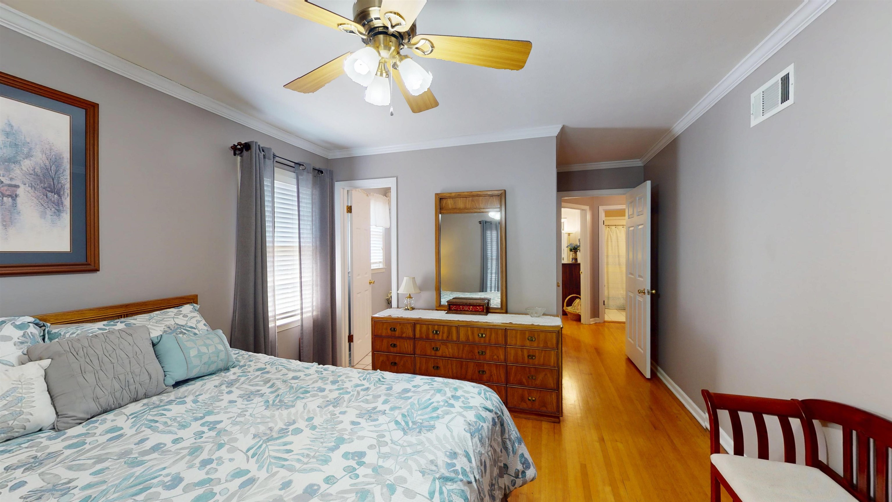 897 Bartlett Road Memphis, TN 38122 - Photo 22 of 33 a bedroom with a bed and a chandelier