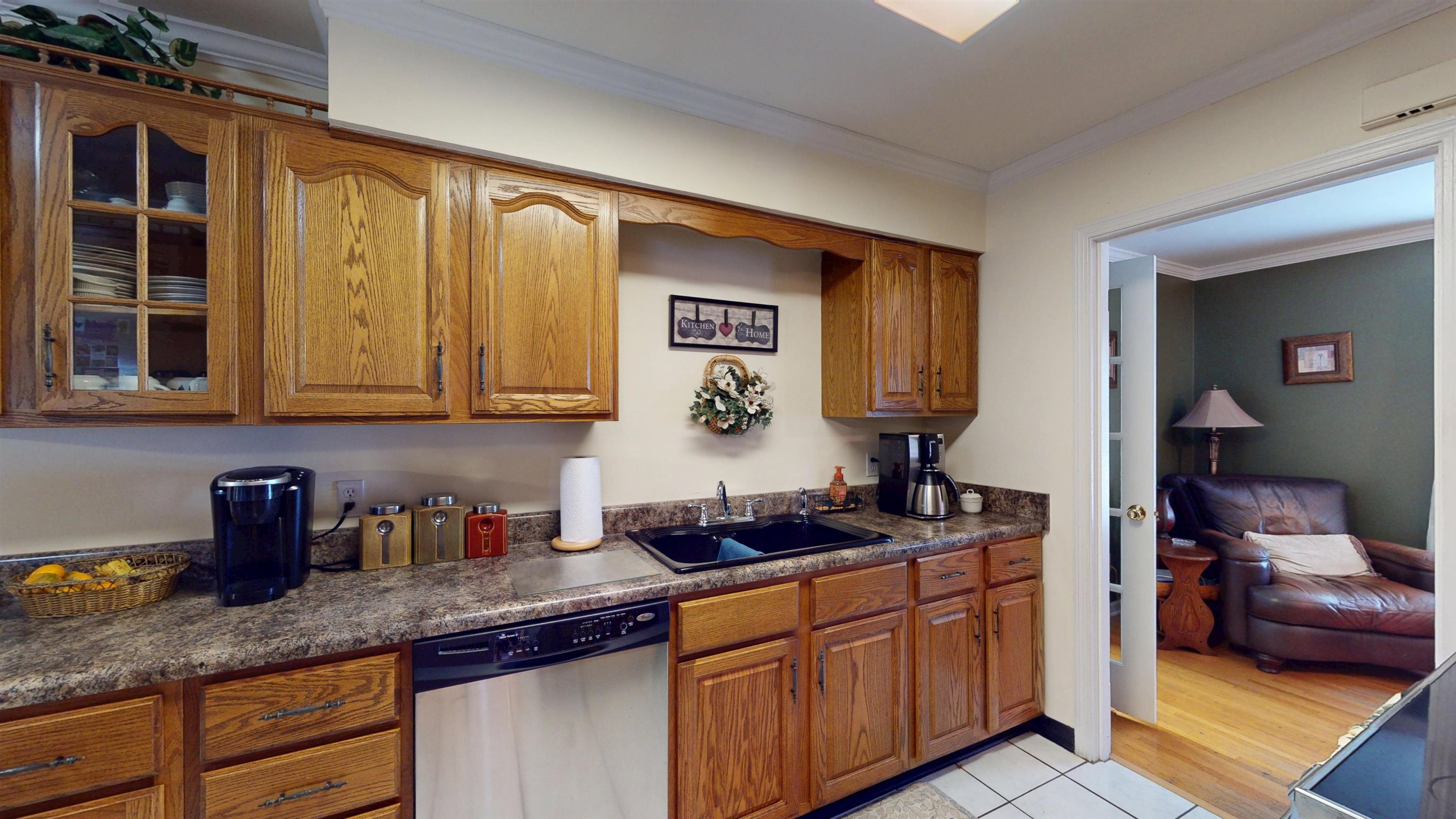 897 Bartlett Road Memphis, TN 38122 - Photo 7 of 33 a kitchen with stainless steel appliances granite countertop a sink dishwasher stove and cabinets