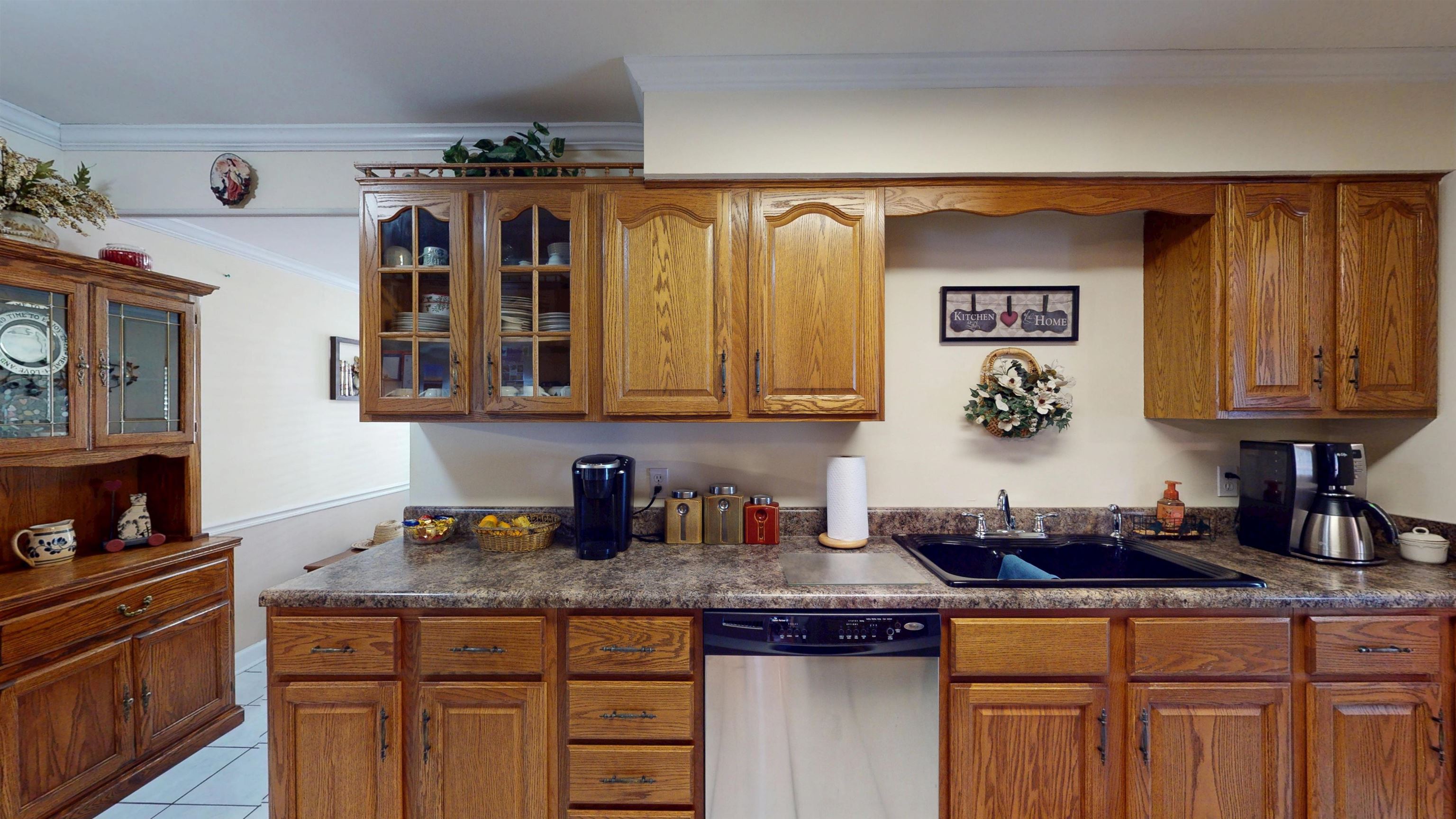 897 Bartlett Road Memphis, TN 38122 - Photo 8 of 33 a kitchen with stainless steel appliances granite countertop a sink and cabinets