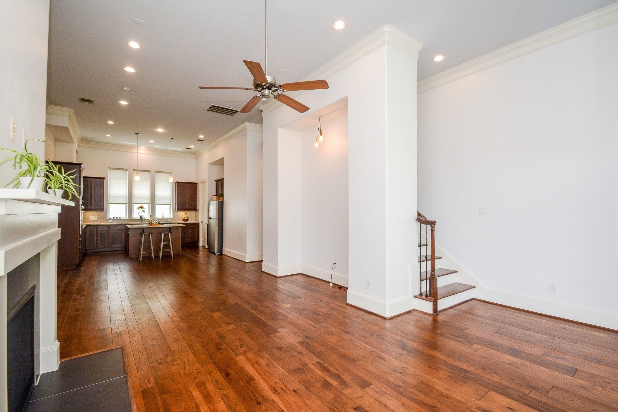 2960 Rusk Street Houston, TX 77003 - Photo 14 of 25 Livingroom, fireplace on left, stairway going to the 3rd level on the right.