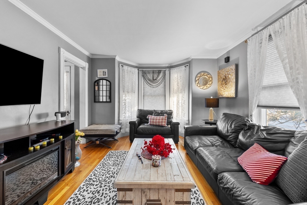 7 Adams Avenue Saugus, MA 01906 - Photo 14 of 38 a living room with furniture and a flat screen tv