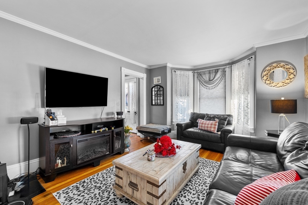 7 Adams Avenue Saugus, MA 01906 - Photo 15 of 38 a living room with furniture and a flat screen tv