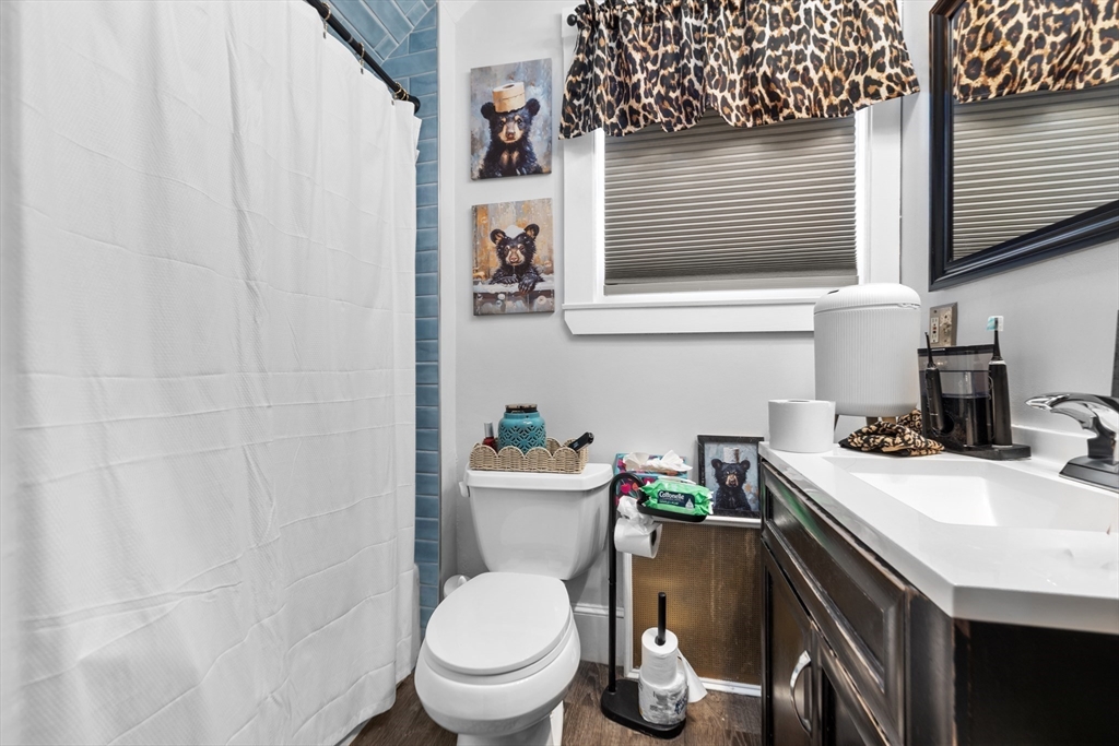 7 Adams Avenue Saugus, MA 01906 - Photo 21 of 38 a bathroom with a sink a toilet and a mirror