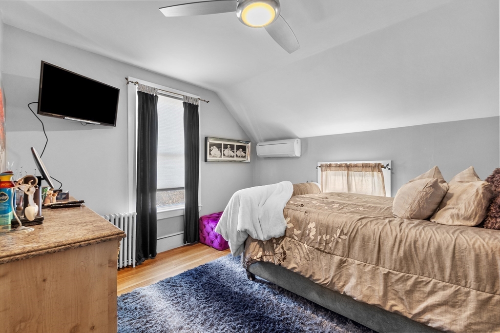 7 Adams Avenue Saugus, MA 01906 - Photo 22 of 38 a bedroom with a bed and a flat screen tv