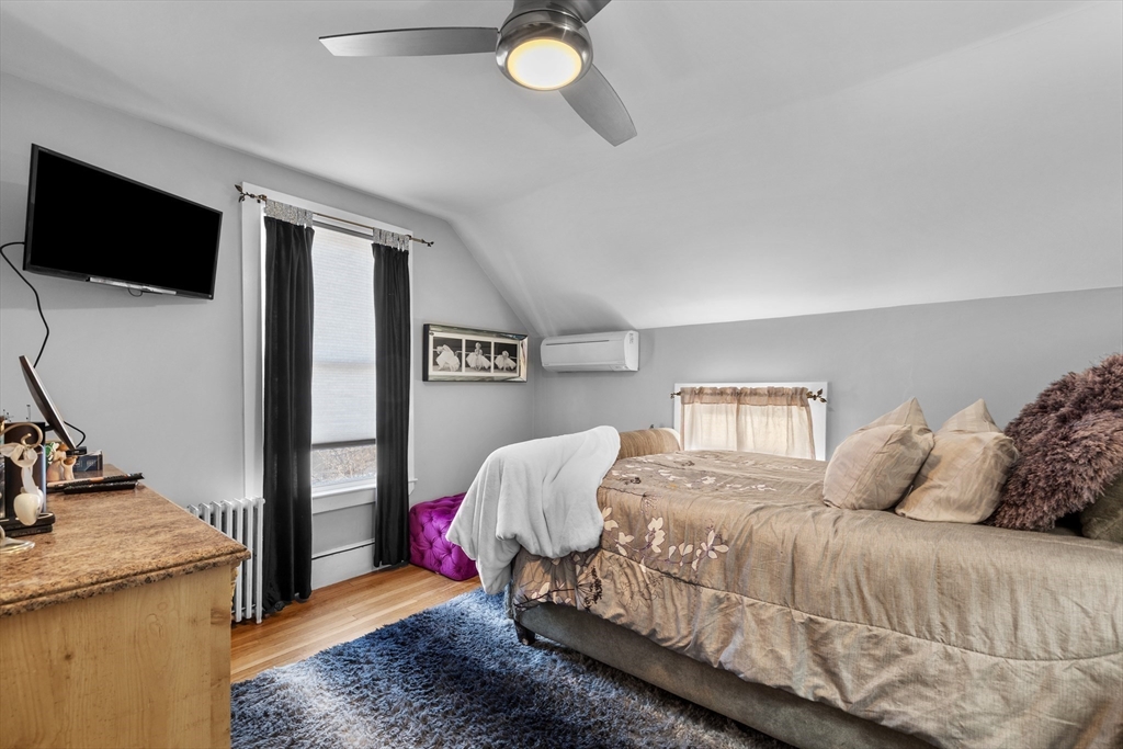 7 Adams Avenue Saugus, MA 01906 - Photo 23 of 38 a bedroom with a bed and flat screen tv