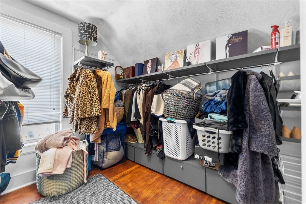 7 Adams Avenue Saugus, MA 01906 - Photo 24 of 38 a view of walk in closet with clothes and shoes