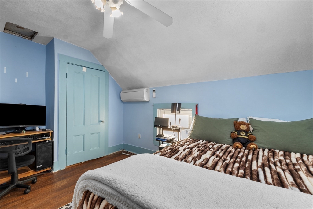 7 Adams Avenue Saugus, MA 01906 - Photo 26 of 38 a bedroom with a bed and a flat screen tv