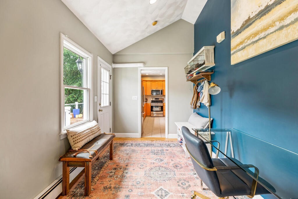 45 Spring Street Stoneham, MA 02180 - Photo 13 of 30 a view of a hallway with windows