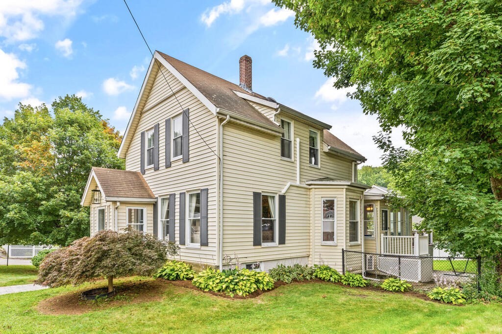 45 Spring Street Stoneham, MA 02180 - Photo 2 of 30 a front view of a house with garden