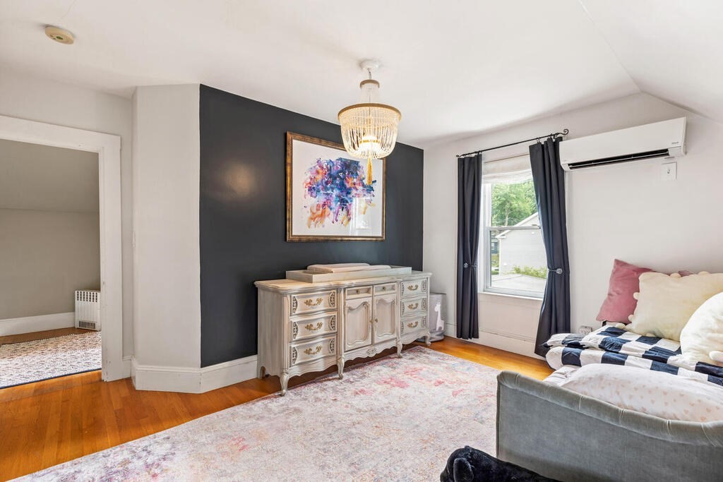45 Spring Street Stoneham, MA 02180 - Photo 22 of 30 a bedroom with furniture and a window