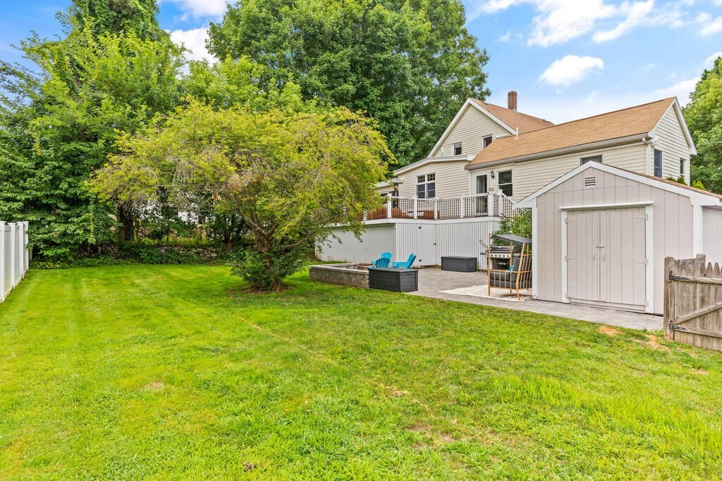 45 Spring Street Stoneham, MA 02180 - Photo 29 of 30 a view of a house with a big yard plants and large trees