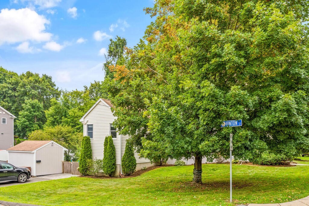 45 Spring Street Stoneham, MA 02180 - Photo 30 of 30 a view of a house with backyard and trees