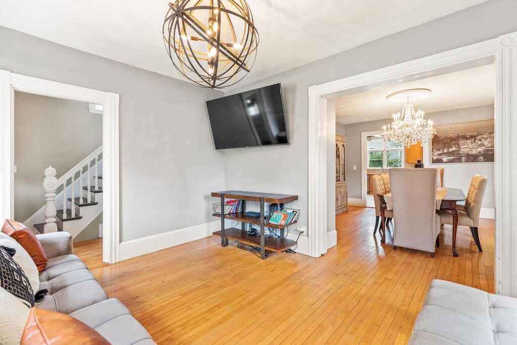 45 Spring Street Stoneham, MA 02180 - Photo 6 of 30 a living room with furniture wooden floor and a flat screen tv
