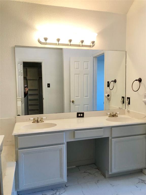 10350 Hampton Court Frisco, TX 75035 - Photo 14 of 27 a bathroom with a sink and a mirror